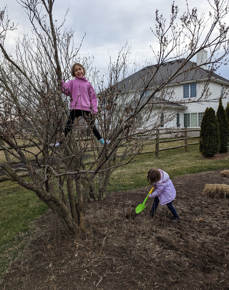Annalyn and Ellerie enjoying spring in their backyard in Perrysburg, OH - March 21, 2023